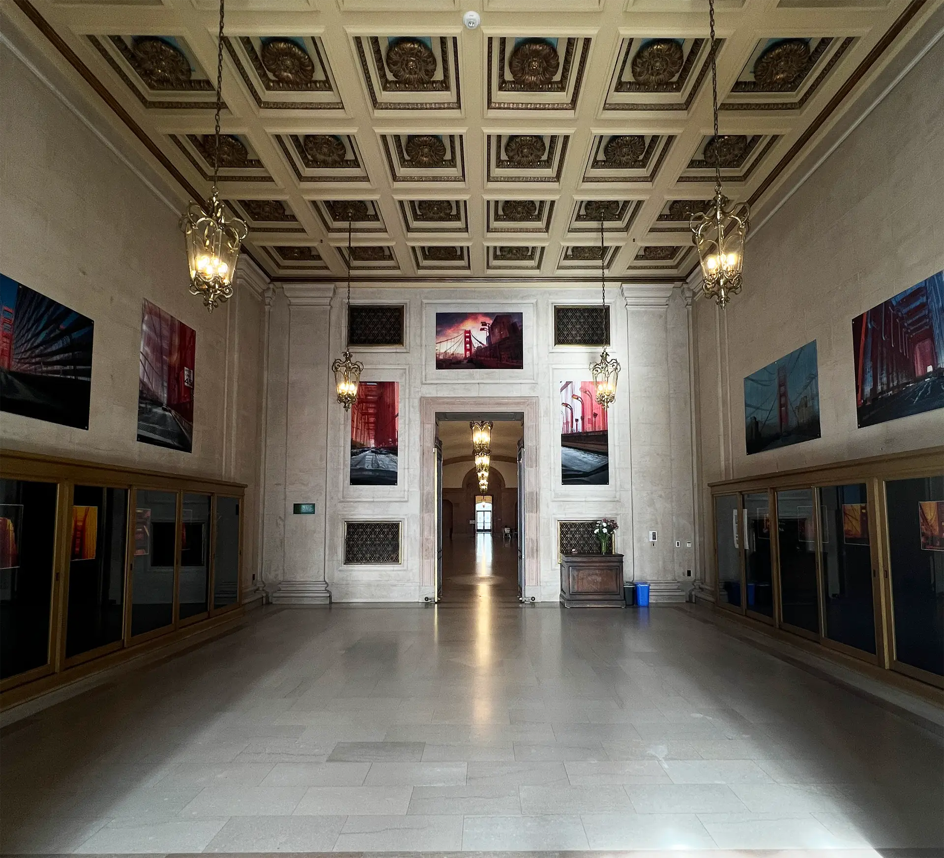 Exhibition Main Room Design. Large-scale photographs line the entryway and walls.