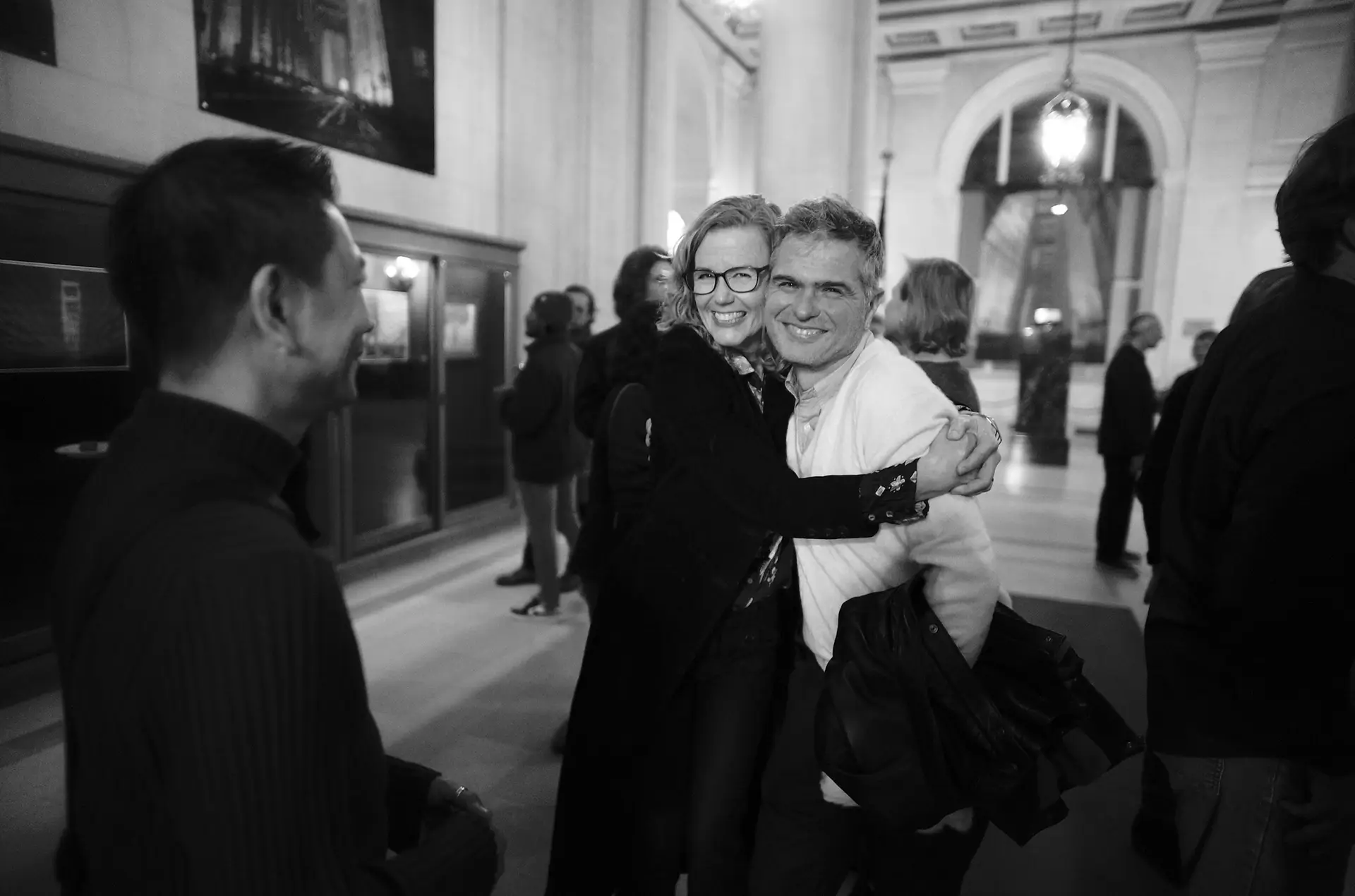 Opening night, couple taking a photo.