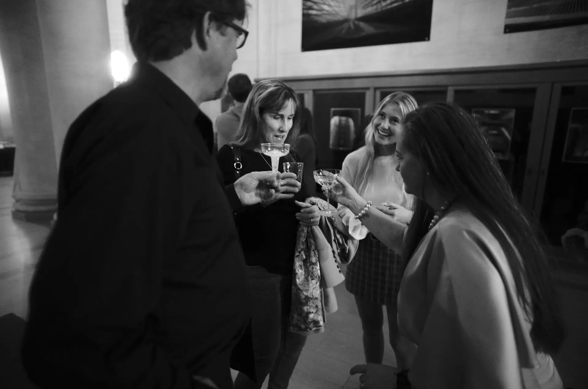 Opening night, group sharing a champaign toast.